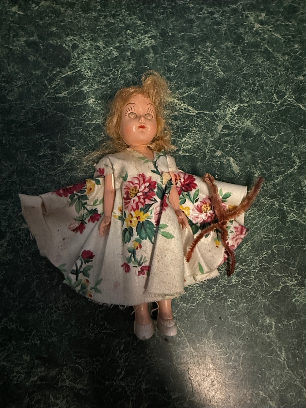Vintage Hard Plastic Doll with Blinking eye and arms that move.